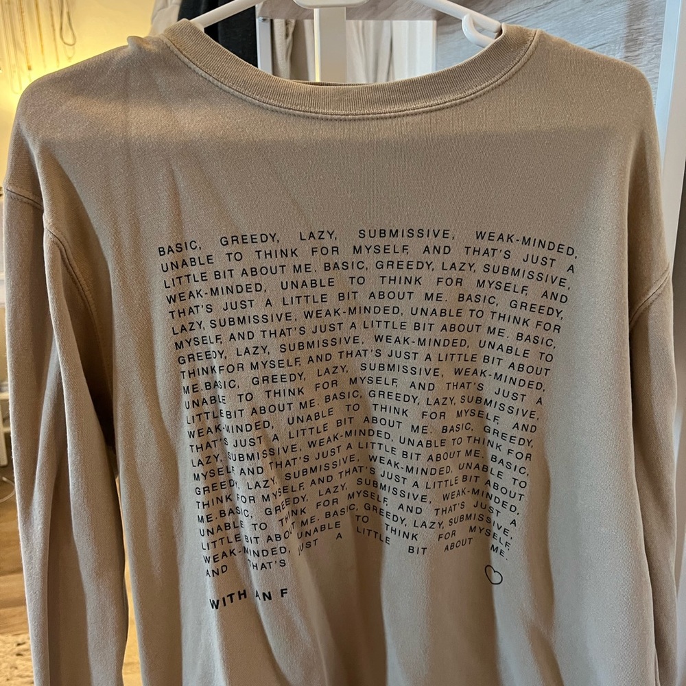 Sofia with an F crewneck sweatshirt